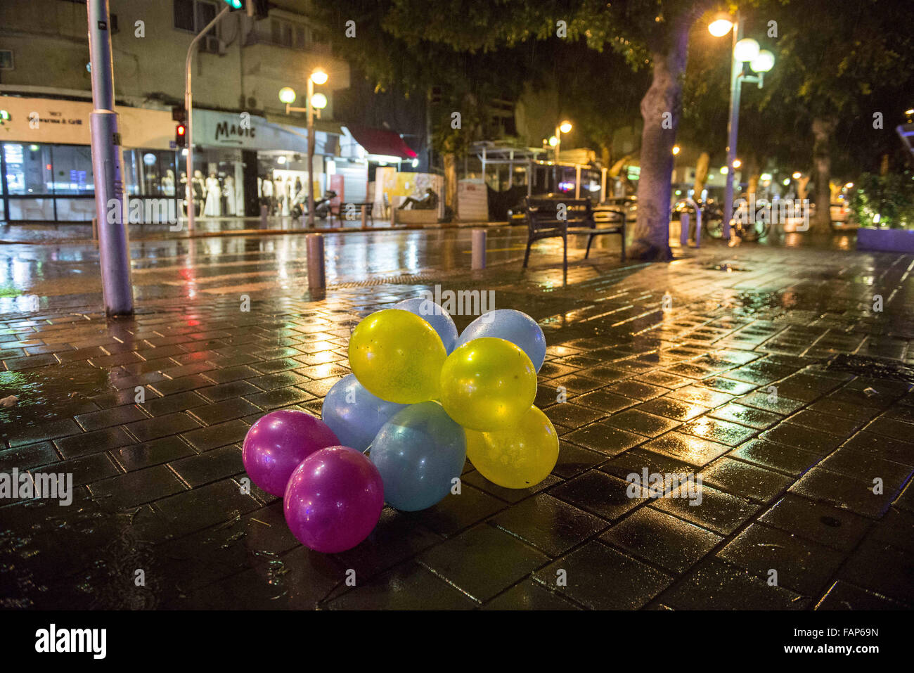 Tel Aviv, Israel, Israel. 2nd Jan, 2016. The crime scene a day later; Balloons left out from the new years parties at Dizengoff street at a rainy night. Credit:  Danielle Shitrit/ZUMA Wire/Alamy Live News Stock Photo