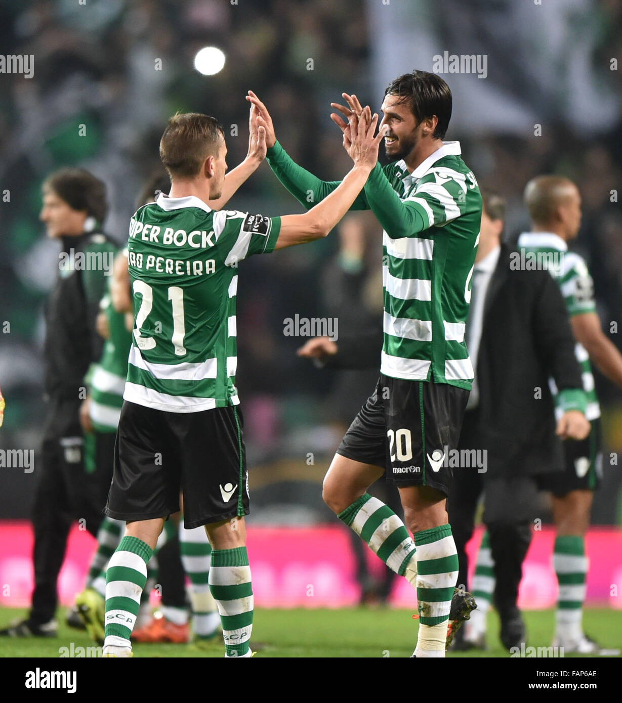 Lisbon, Portugal. 2nd Jan, 2016. Sporting's Bryan Ruiz (R) and Joao Pereira celebrate their victory after the Portuguese League football match against Porto at Alvalade stadium in Lisbon, Portugal, on Jan. 2, 2016. Sporting won 2-0. Credit:  Zhang Liyun/Xinhua/Alamy Live News Stock Photo