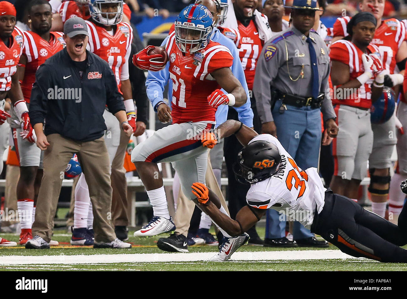 January 01, 2016 - Ole Miss Rebels linebacker Terry Caldwell (21) shrugs off the tackle of Oklahoma State Cowboys safety Tre Flowers (31) during the game between the Ole Miss Rebels and the Oklahoma State Cowboys at the Mercedes-Benz Superdome in New Orleans, LA. Stephen Lew/CSM Stock Photo