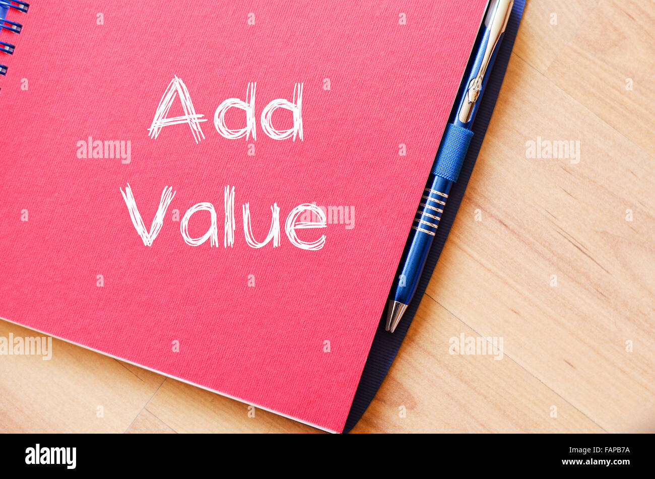 Add valuer text concept write on notebook with pen Stock Photo - Alamy