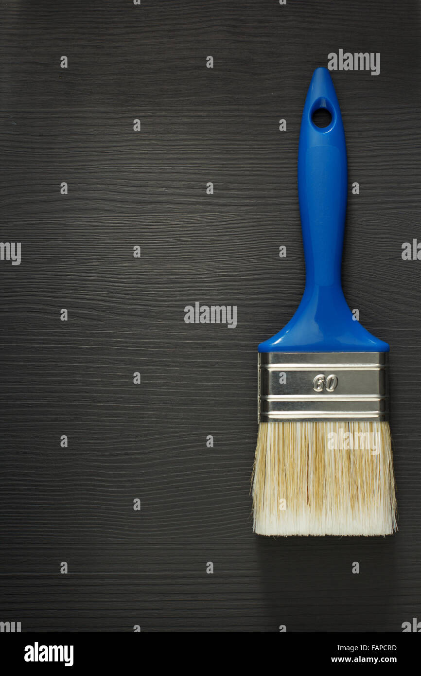 paint brush on wooden background Stock Photo - Alamy