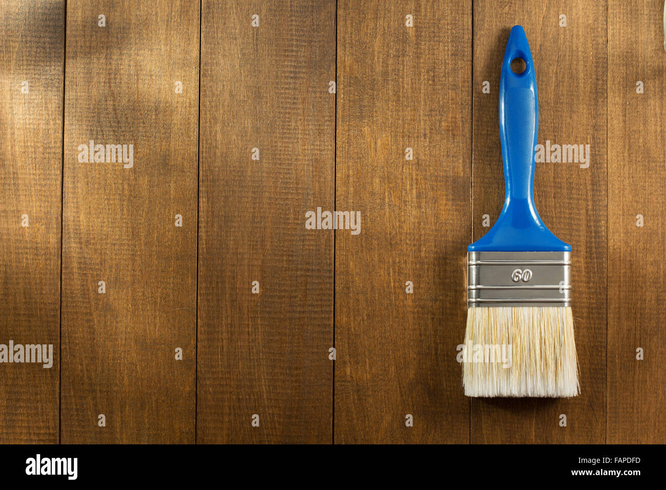 paint brush on wooden background Stock Photo - Alamy