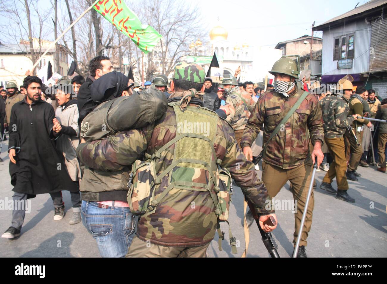 Srinagar, India. 03rd Jan, 2016. Policeman detained kashmiri shiite muslims protest against the kiliing of Shiekh Nimr. Credit:  Basit zargar/Alamy Live News Stock Photo