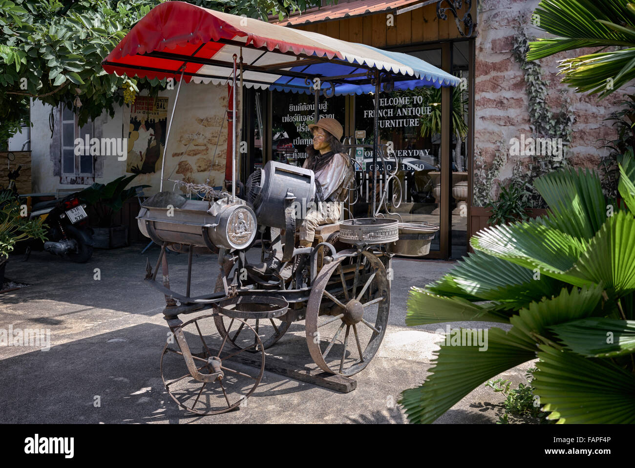 French antique shop exterior with imaginative and appropriate feature display object. Thailand S. E. Asia. Stock Photo