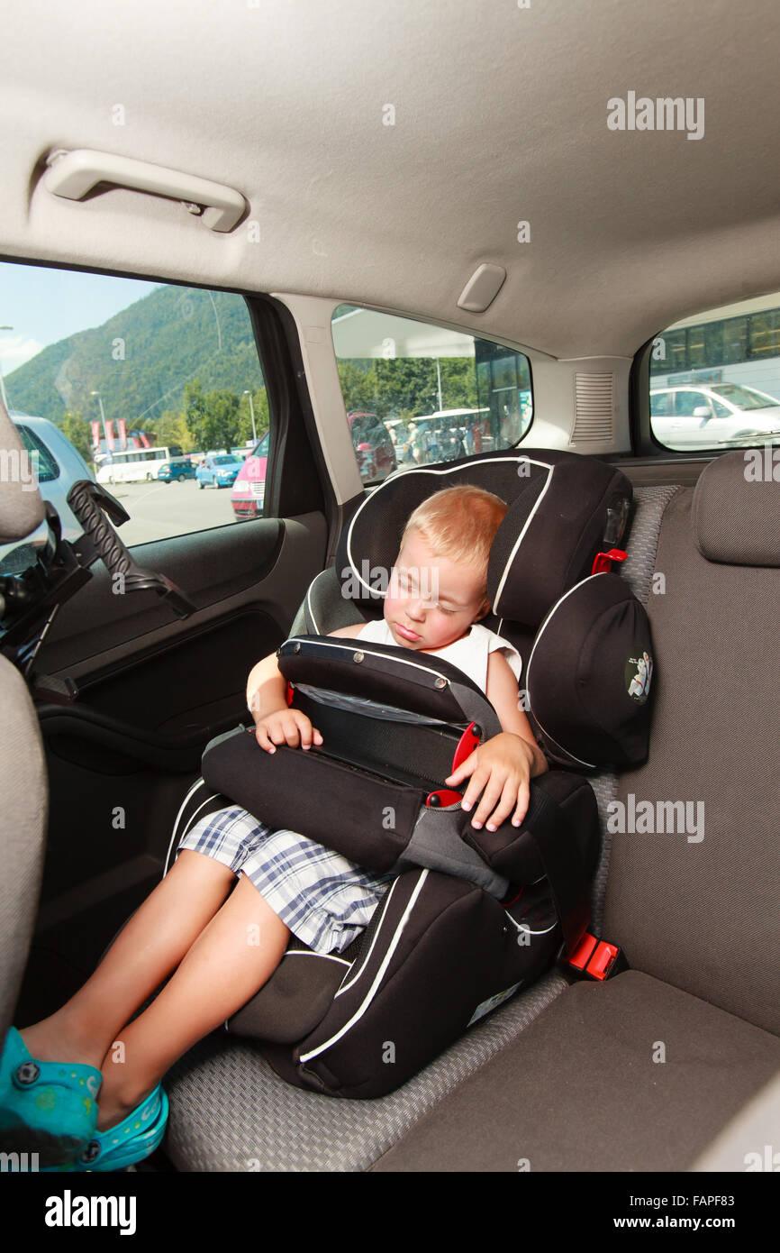 Little boy sleeping in car seat safety Stock Photo Alamy