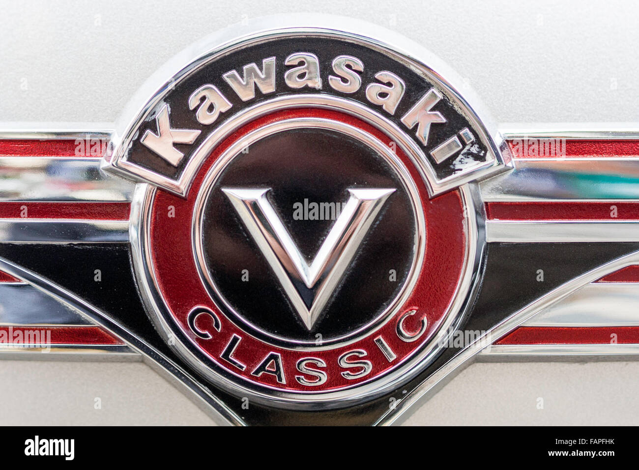 Close up of Kawasaki Classic V motor-bike badge logo in black silver and  purple Stock Photo - Alamy
