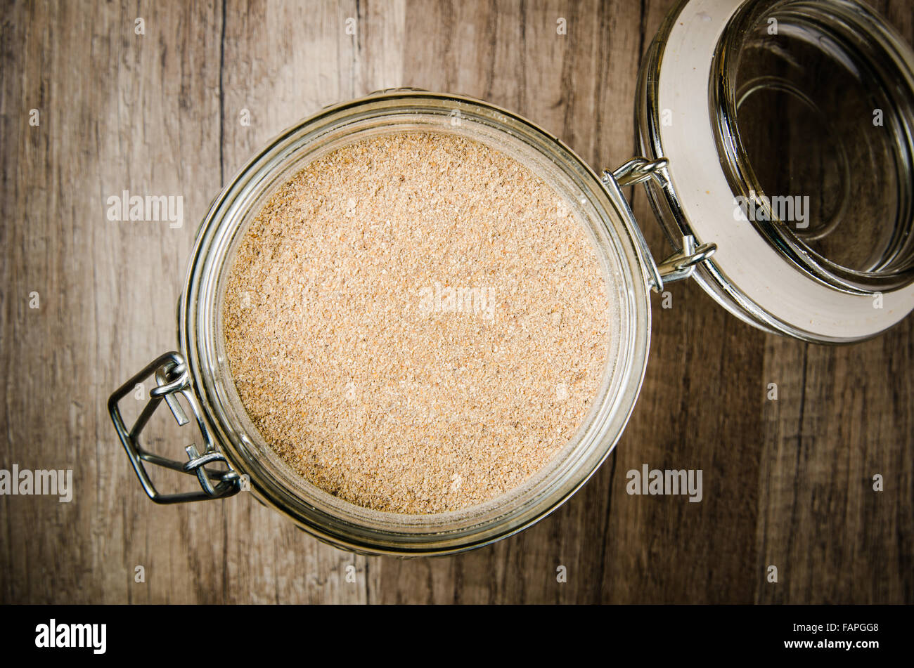 Wholemeal flour in a glass jar Stock Photo Alamy