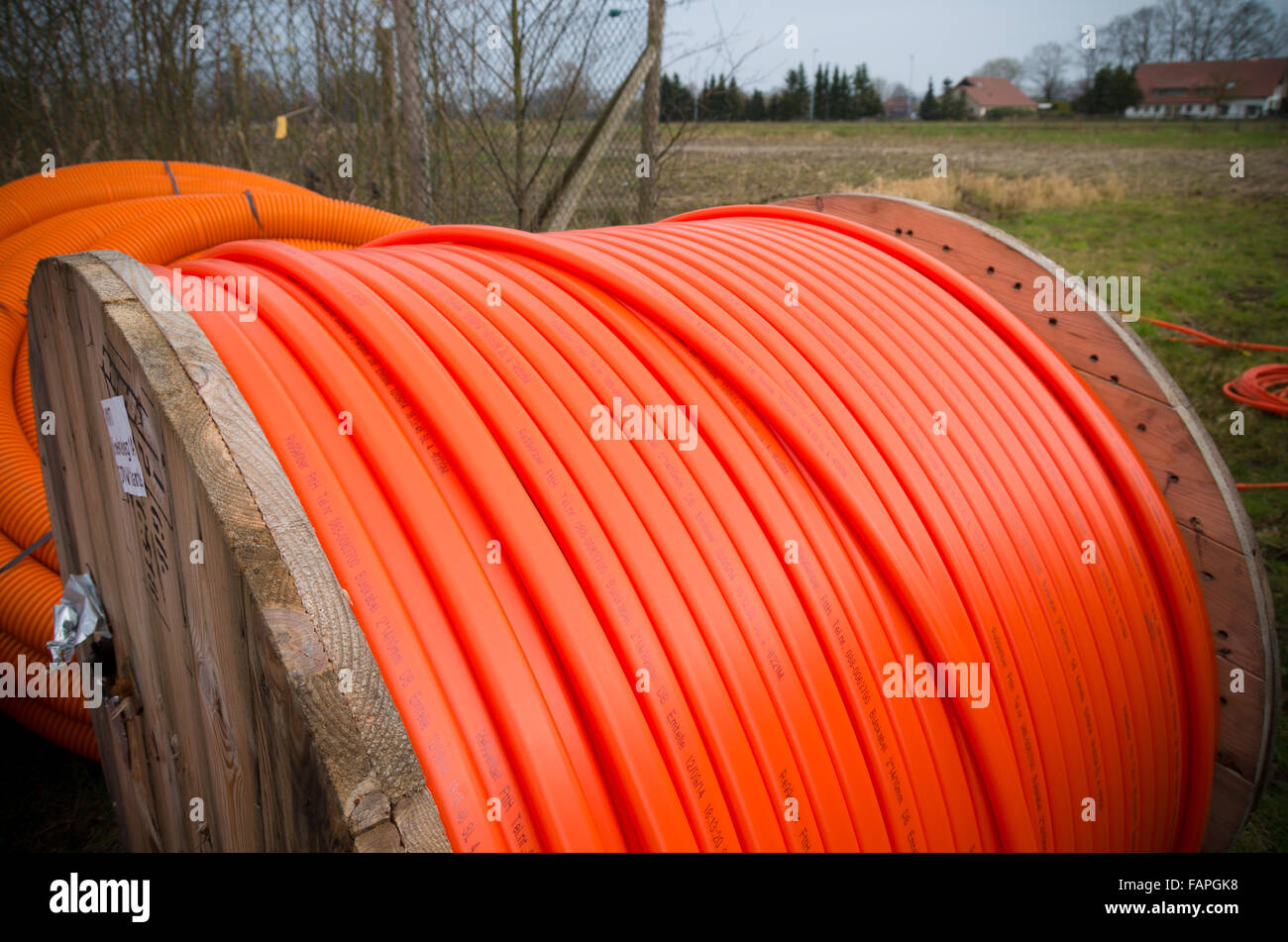 HENGELO, NETHERLANDS - MARCH 28, 2015: Drums with orange fiber cable owned by Reggefiber, a Dutch company that specializes in th Stock Photo