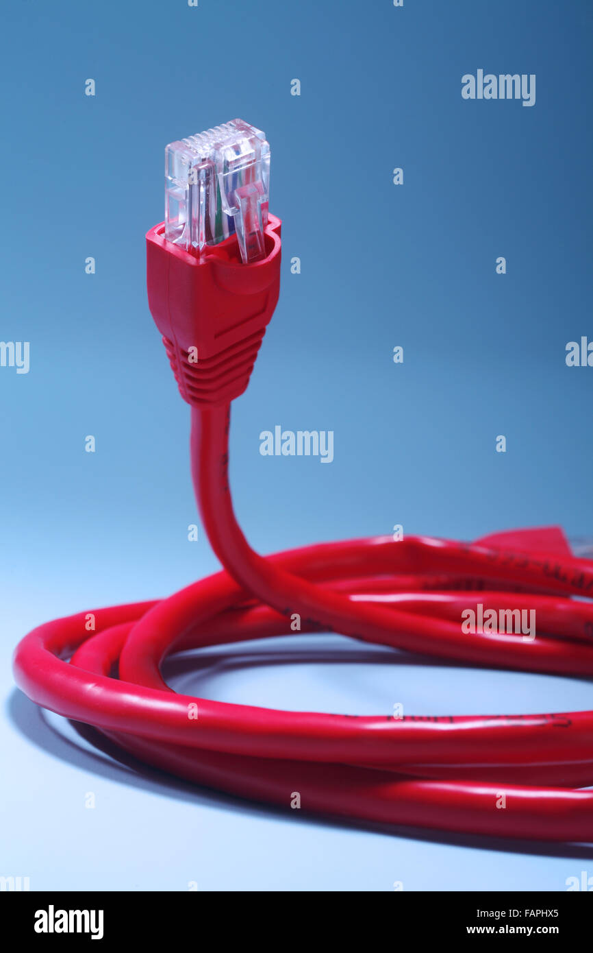 Ethernet cable against color background Stock Photo