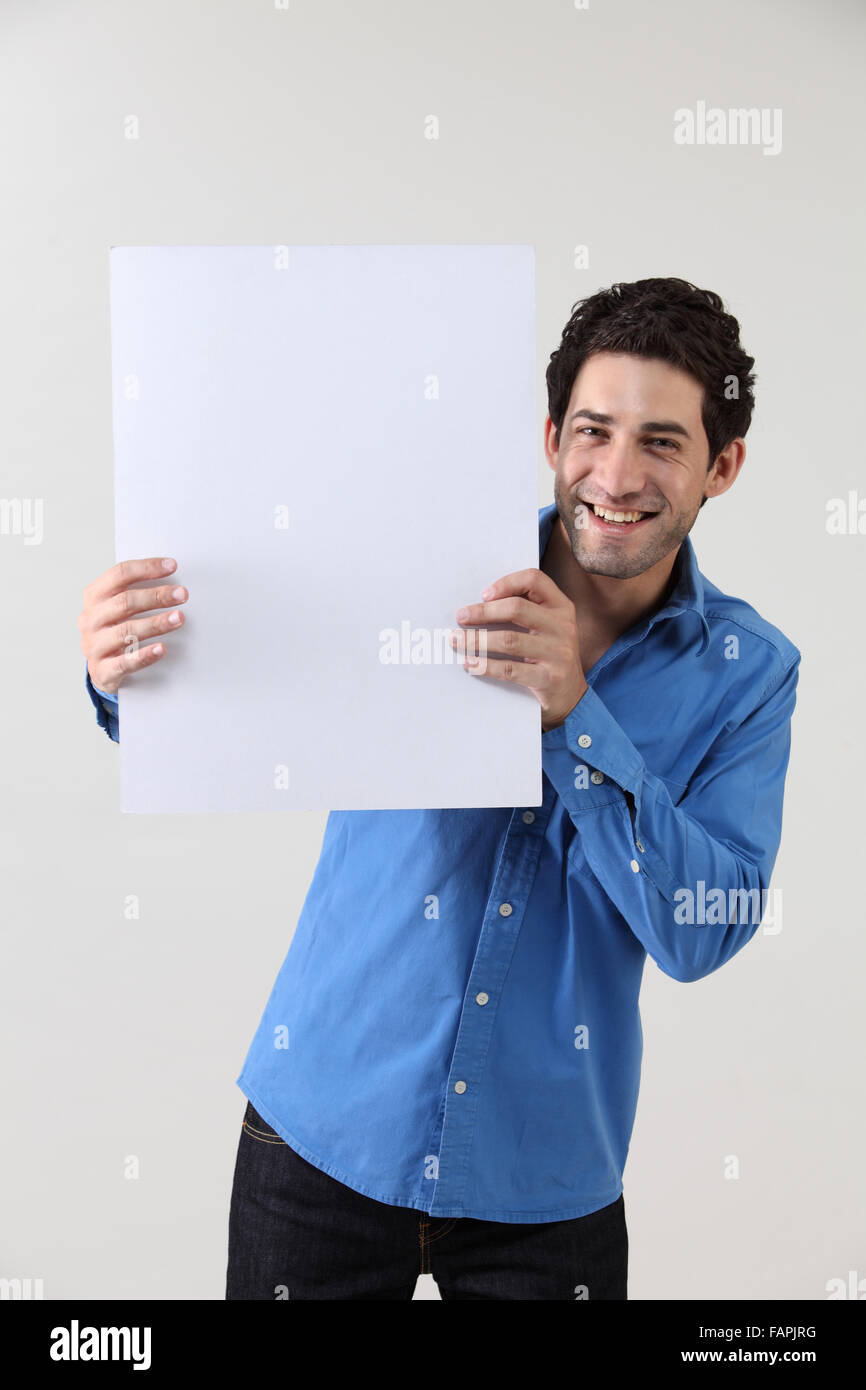 Man holding blank paper Stock Photo - Alamy