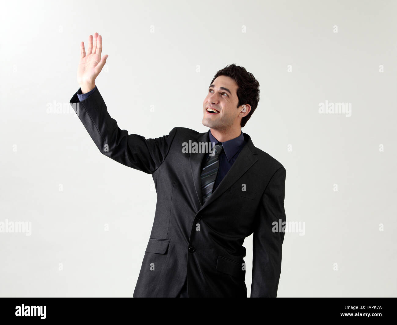 businessman arm raised waving in the air Stock Photo Alamy