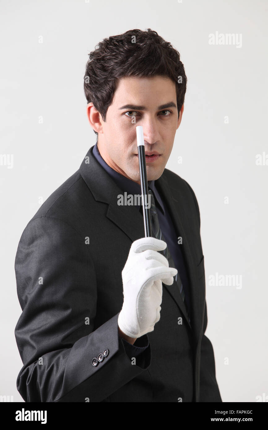 Businessman dressed as magician Stock Photo - Alamy