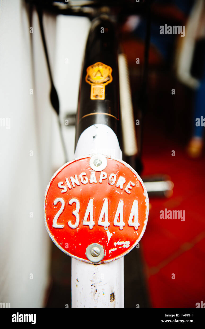 Singapore bicycle licence plate mounted on the back fender of old