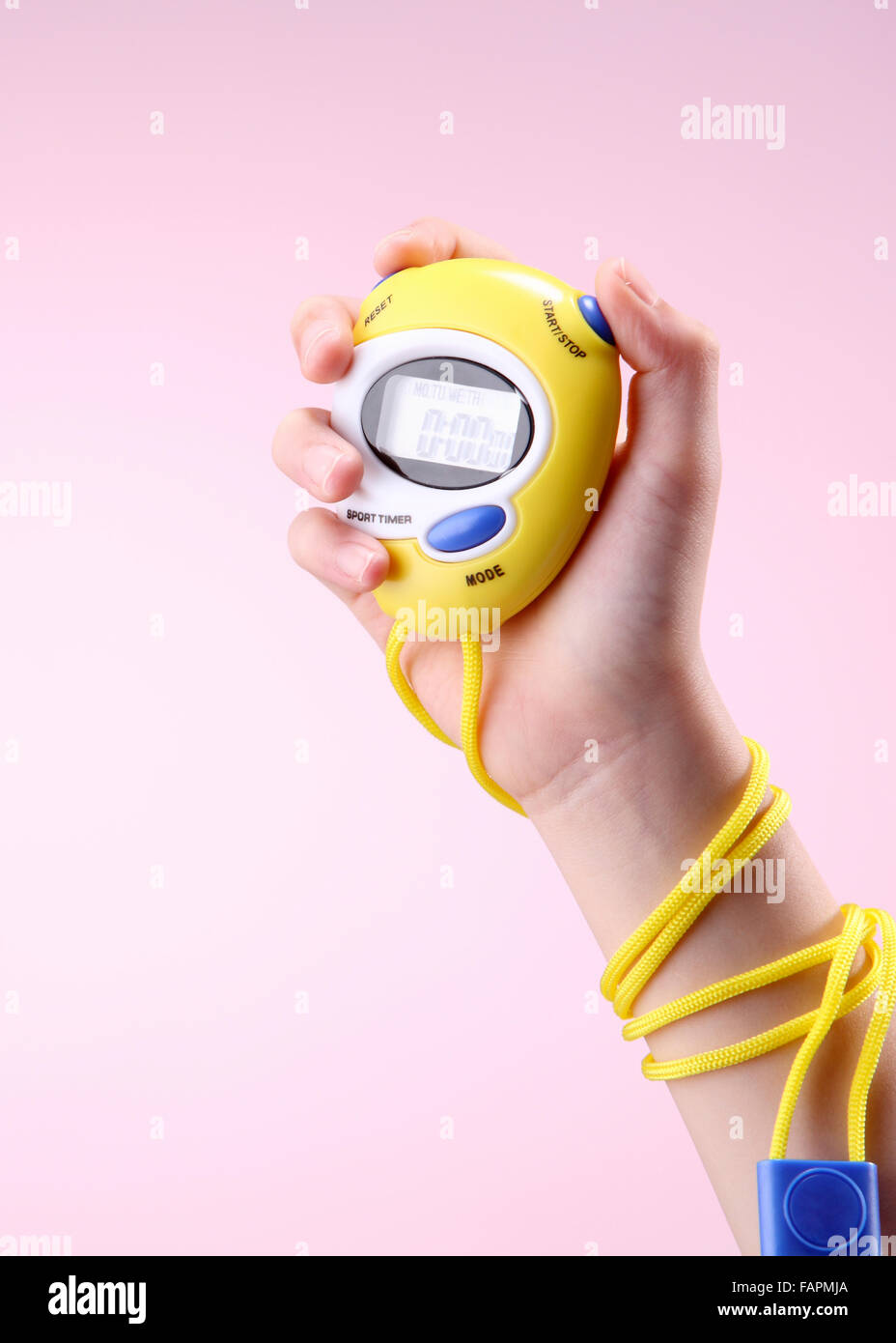 kid holding a digital stopwatch Stock Photo