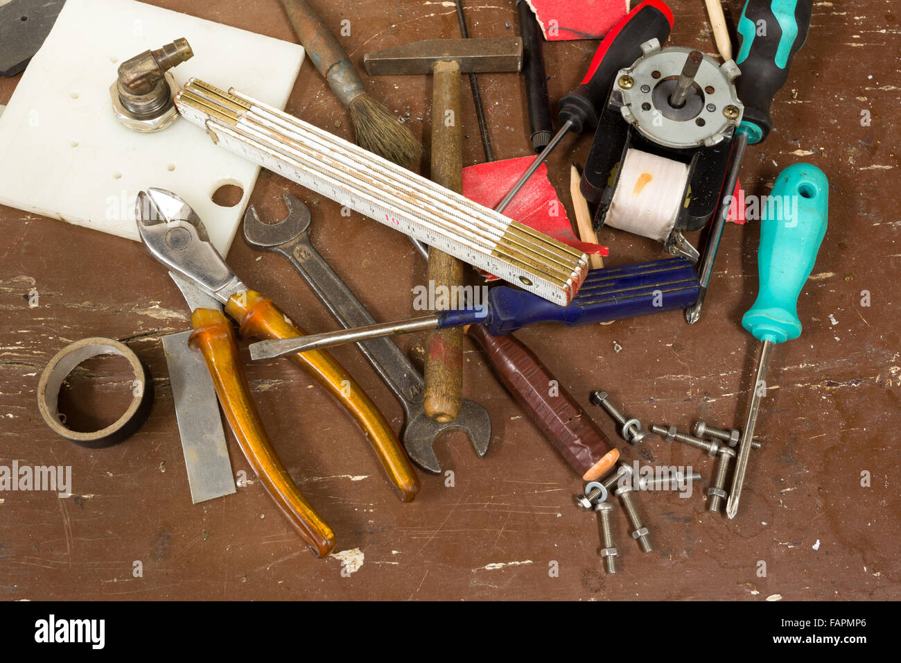 diy workshop tools on table, untidy, ready for work stock