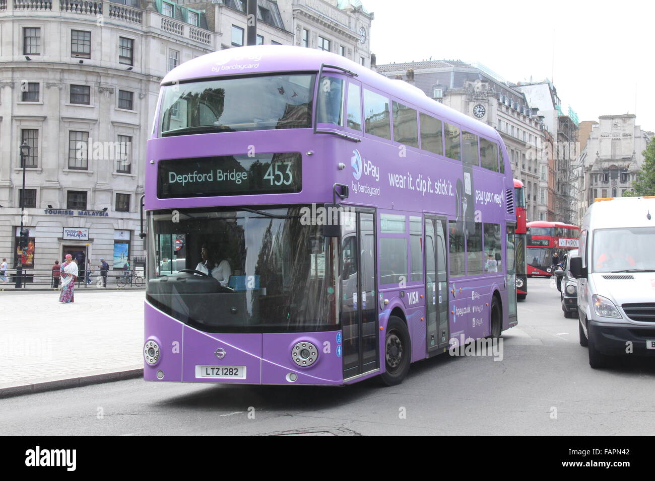 A PURPLE NEW ROUTEMASTER BUS IN LONDON ADVERTISING BARCLAYCARD Stock Photo
