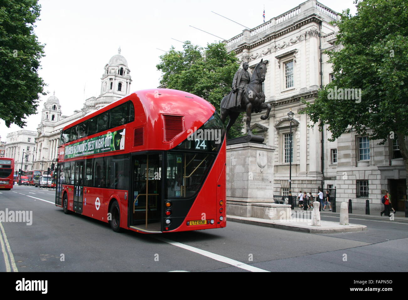REAR VIEW OF NEW ROUTEMASTER BUS IN WHITEHALL IN LONDON SHOWING REAR DOOR OPEN AS CONDUCTOR ON BOARD Stock Photo