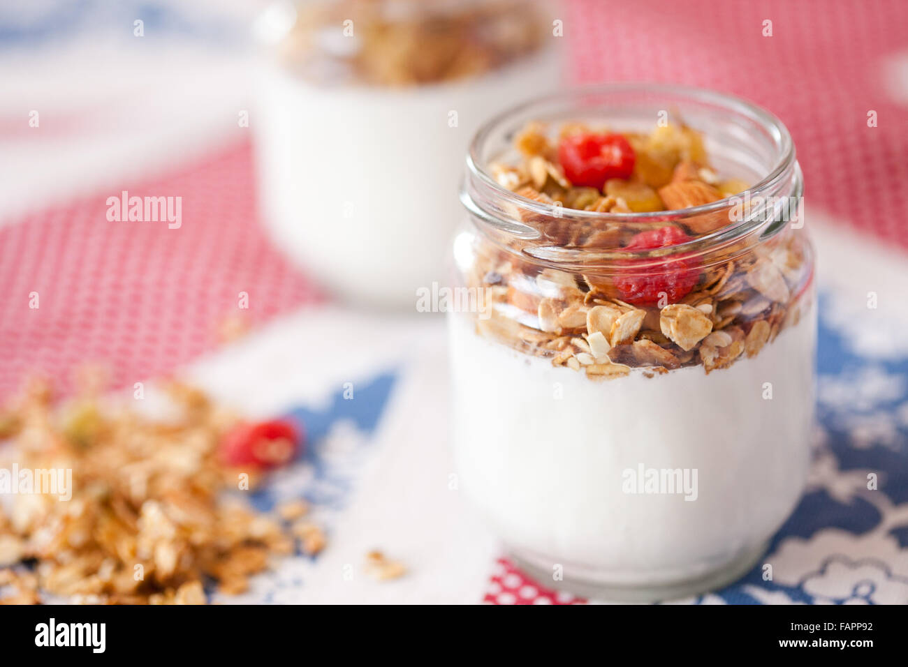 delicious and healthy yogurt and granola, fruits, nuts, grains Stock