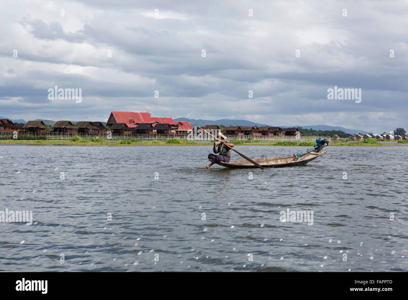 A fisherman from the Intha people rowing his boat on Inle Lake in Myanmar (Burma). Stock Photo
