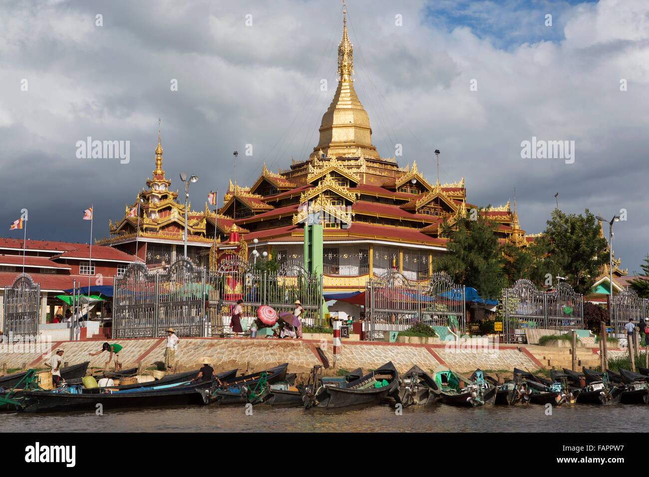 Boats moored by Shwe Indein Pagoda on Inle Lake in Myanmar (Burma). The pagoda is a Buddhist place of worship. Stock Photo