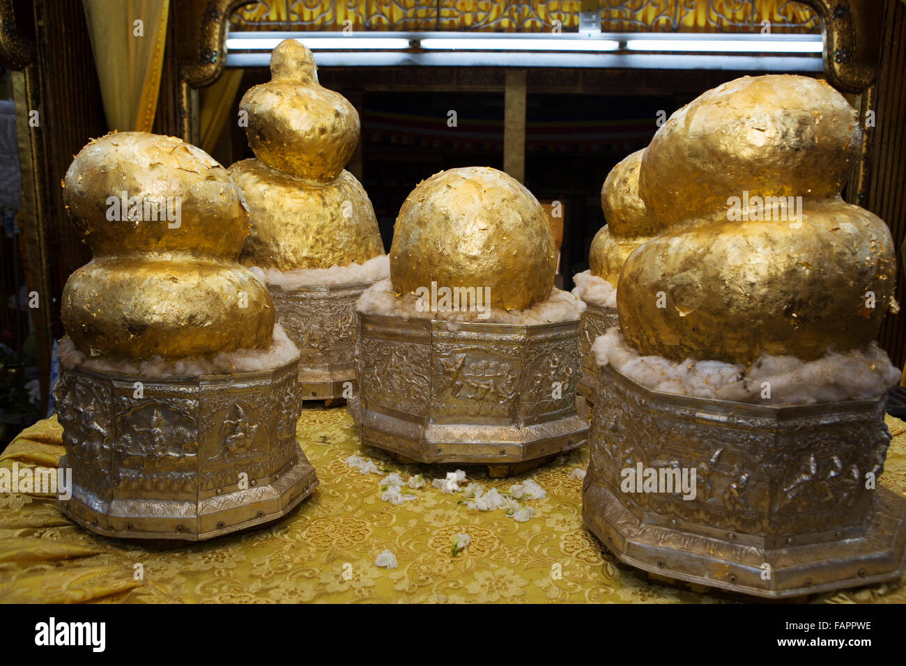 Gold covered Buddha statues at the Shwe Indein Pagoda on Inle Lake in Myanmar (Burma). The pagoda is a Buddhist place of worship Stock Photo