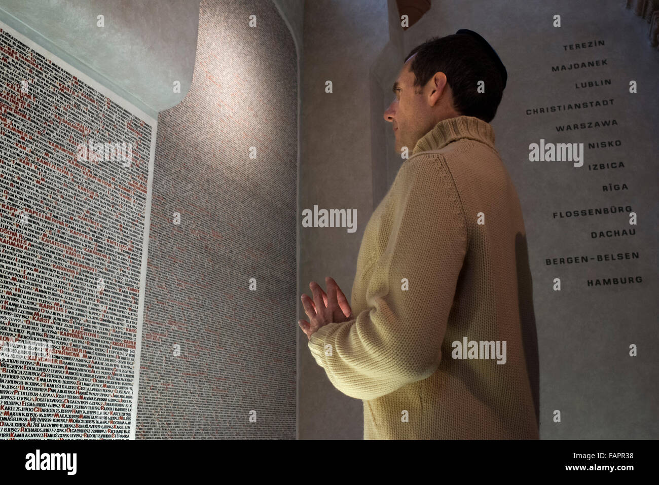 Pinaks Praying beside the names of the victims on the walls of the Pinkas ...
