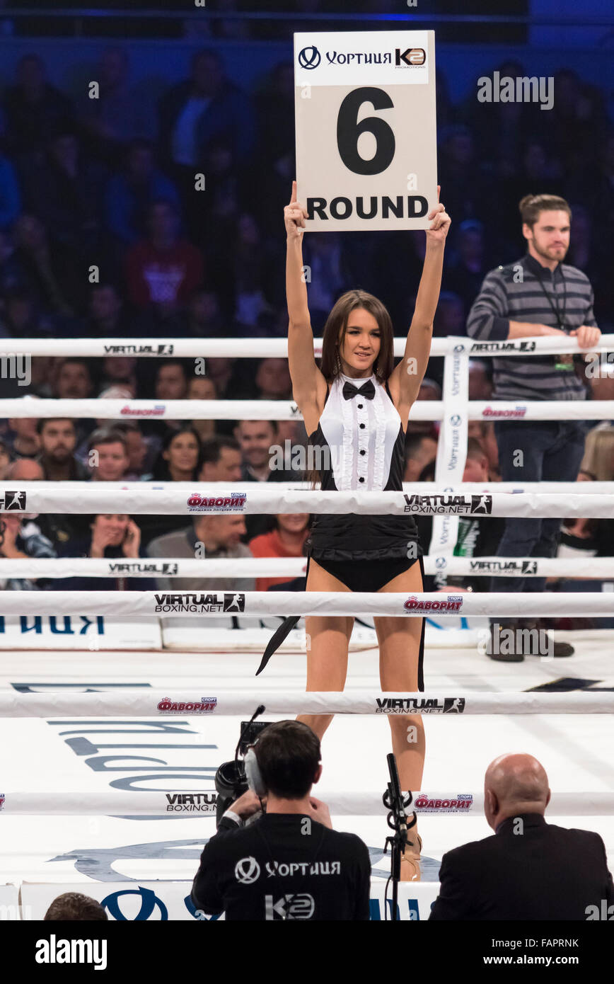 KYIV, UKRAINE - DECEMBER 12, 2015: Boxing ring girls holding a board with round number during WBO Intercontinental cruiserweight Title fight Oleksandr Usyk vs Pedro Rodriguez at Palace of Sports Stock Photo