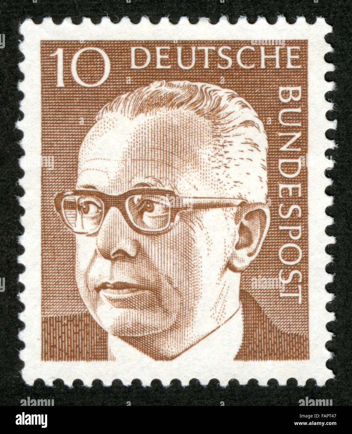 GERMANY - CIRCA 1971 A stamp printed in Germany showing a portrait of Federal President Gustav Walter Heinemann, circa 1971 Stock Photo