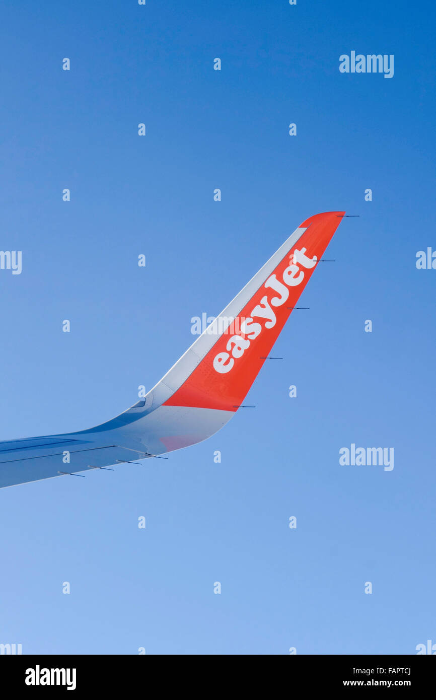 Easyjet low-cost airline aircraft, wingtip with logotype. Stock Photo