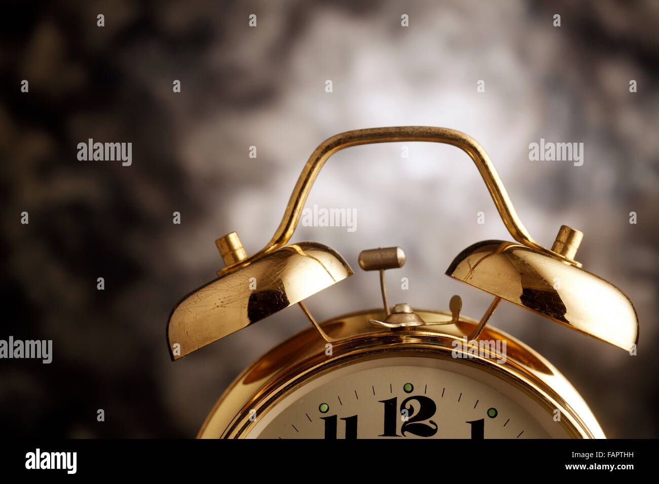 Old alarm clock isolated on the background Stock Photo - Alamy