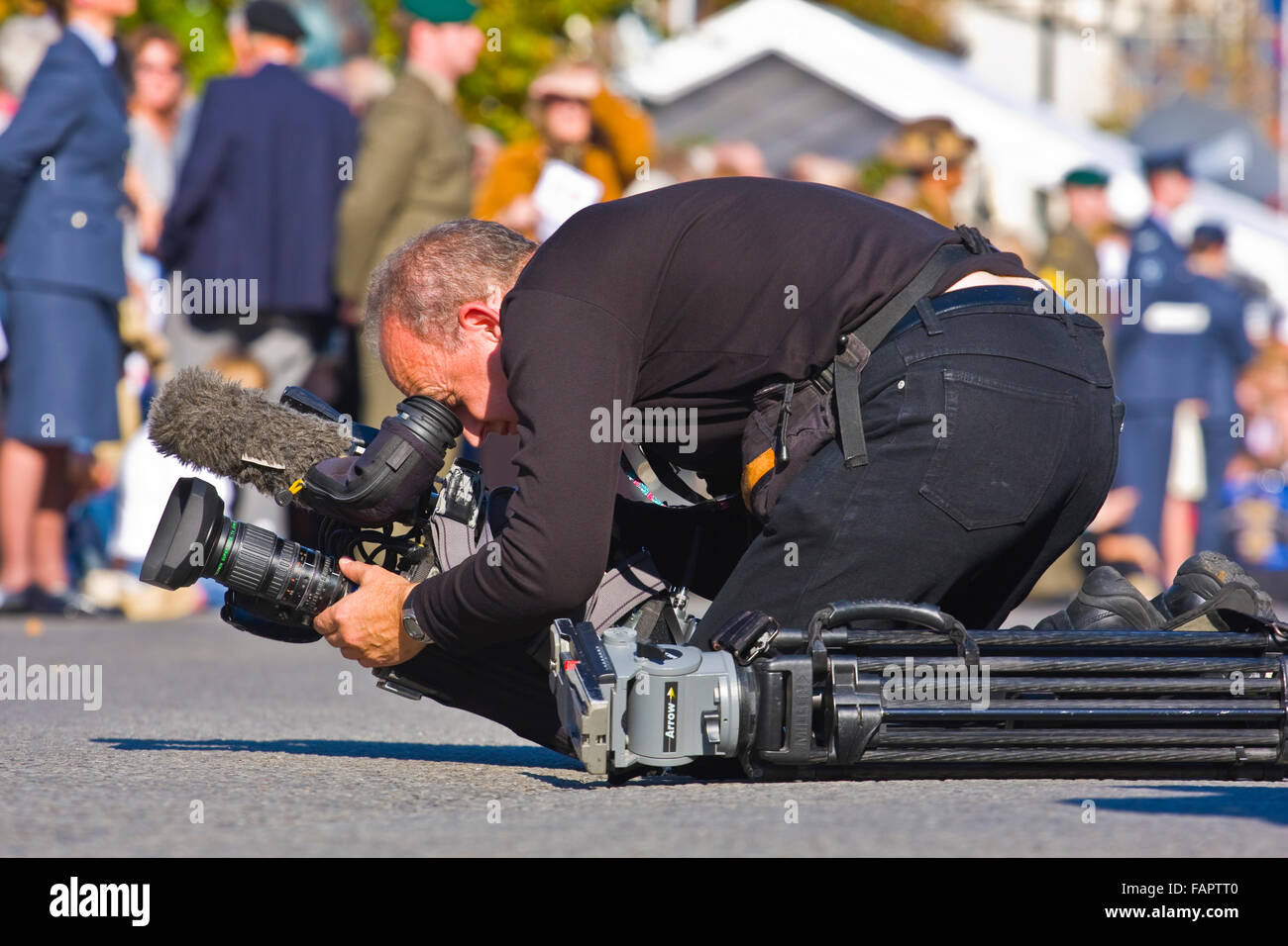 TV Camera Man shoots footage of appreciation parade Royal Wootton Basset, Wiltshire Stock Photo