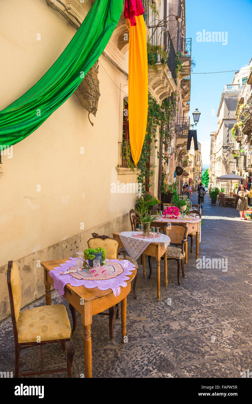 Italy street restaurant, view of tables sited outside a trattoria in