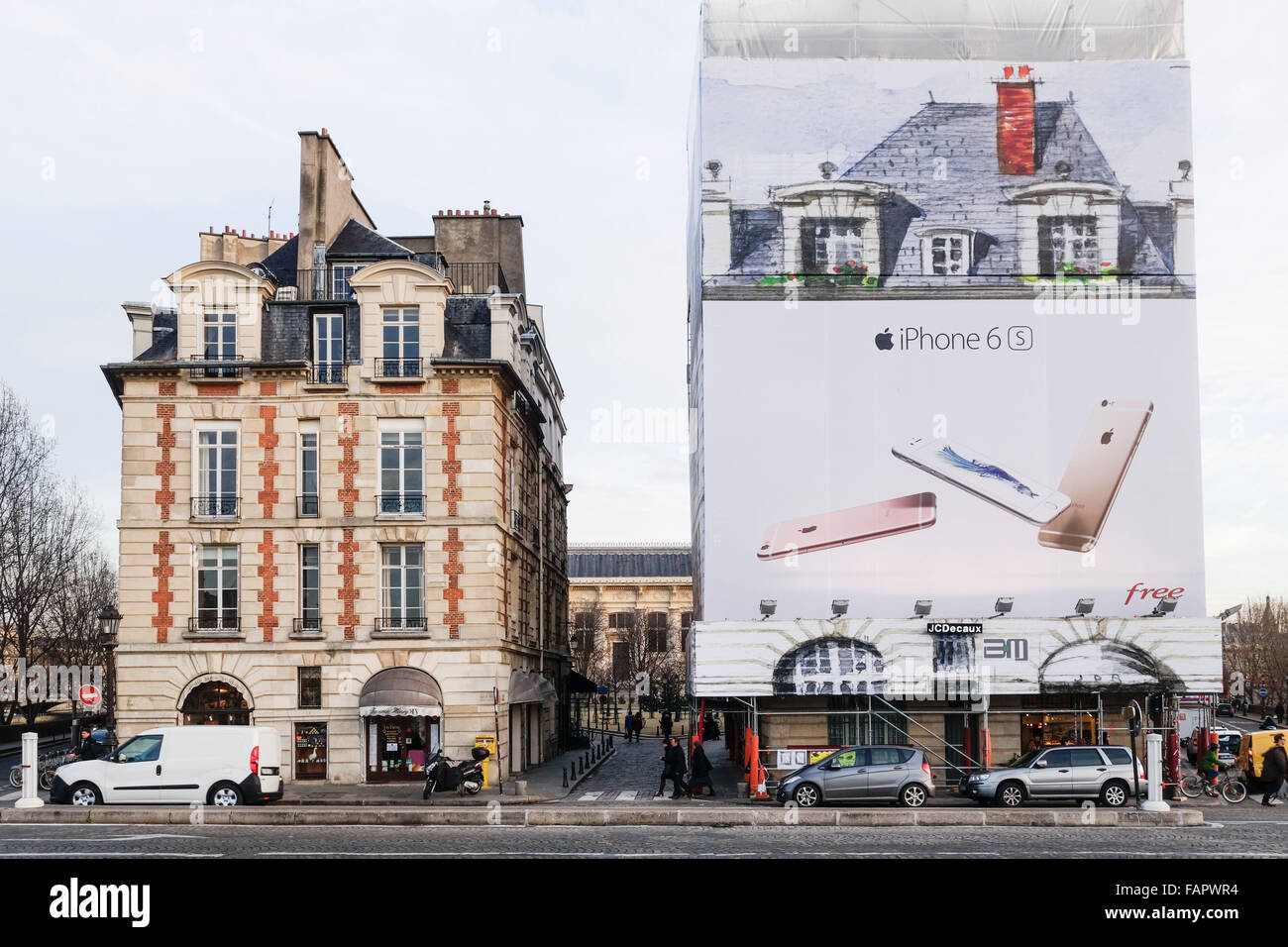 Billboard of iphone 6 s covering monumental building as financial sponsorship for reconstruction  Paris, France. Stock Photo