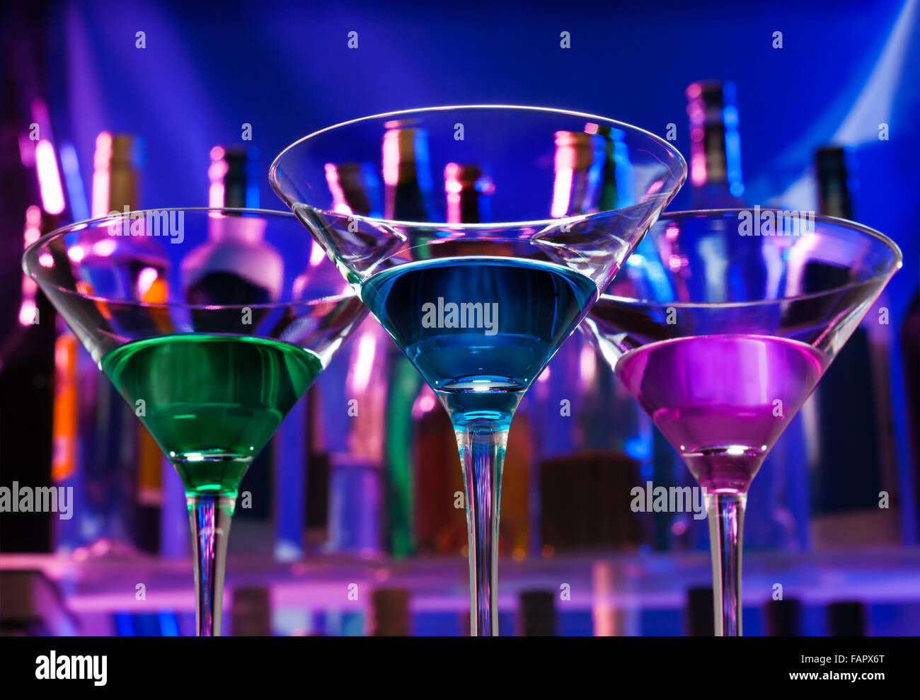 Three cocktails in martini glasses Stock Photo Alamy