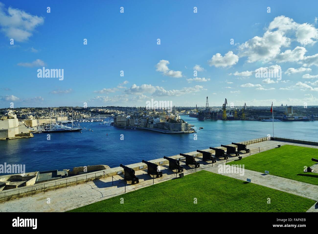 Valletta Malta view of marine boat boating life on the ocean from the War Rooms with Canons Stock Photo