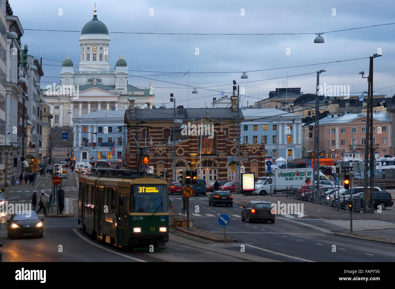 General view of the Helsinki city with the tram, market, and the Senaatintori Lutheran Cathedral from the Eteläranta street. Stock Photo