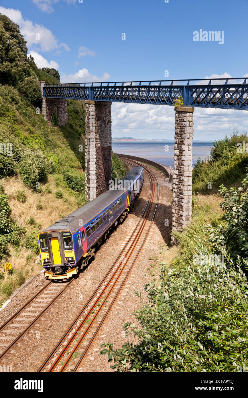 First Great Western train on the Teignmough to Dawlish coastal railway line in Devon Stock Photo