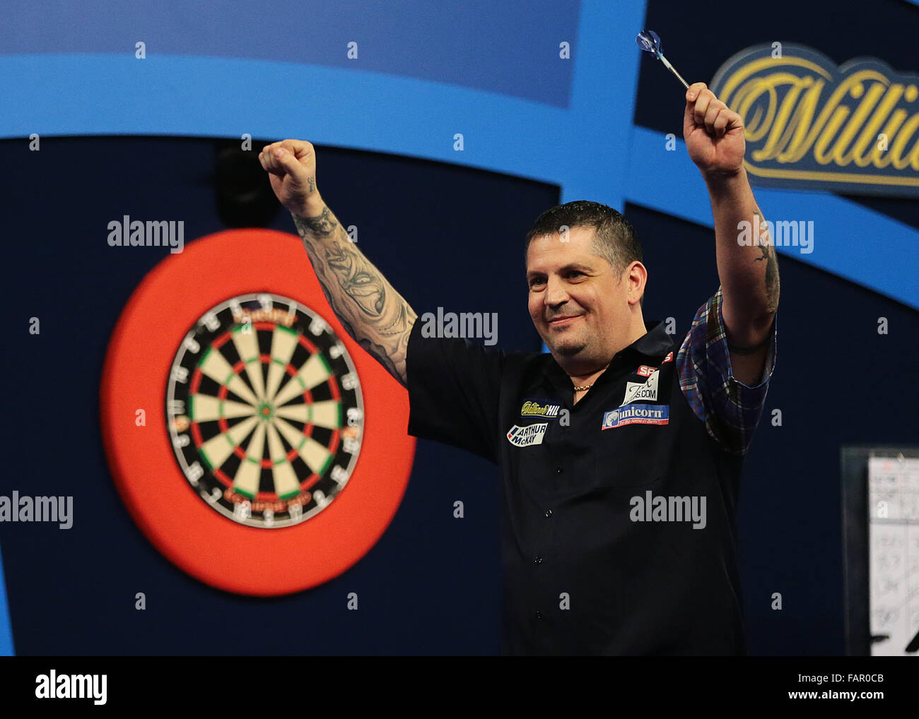 Alexandra Palace, London, UK. 03rd Jan, 2016. William Hill PDC World Darts  Championship. Gary Anderson celebrates winning The World Championship Darts  Final and eyes up the Trophy Credit: Action Plus Sports/Alamy Live