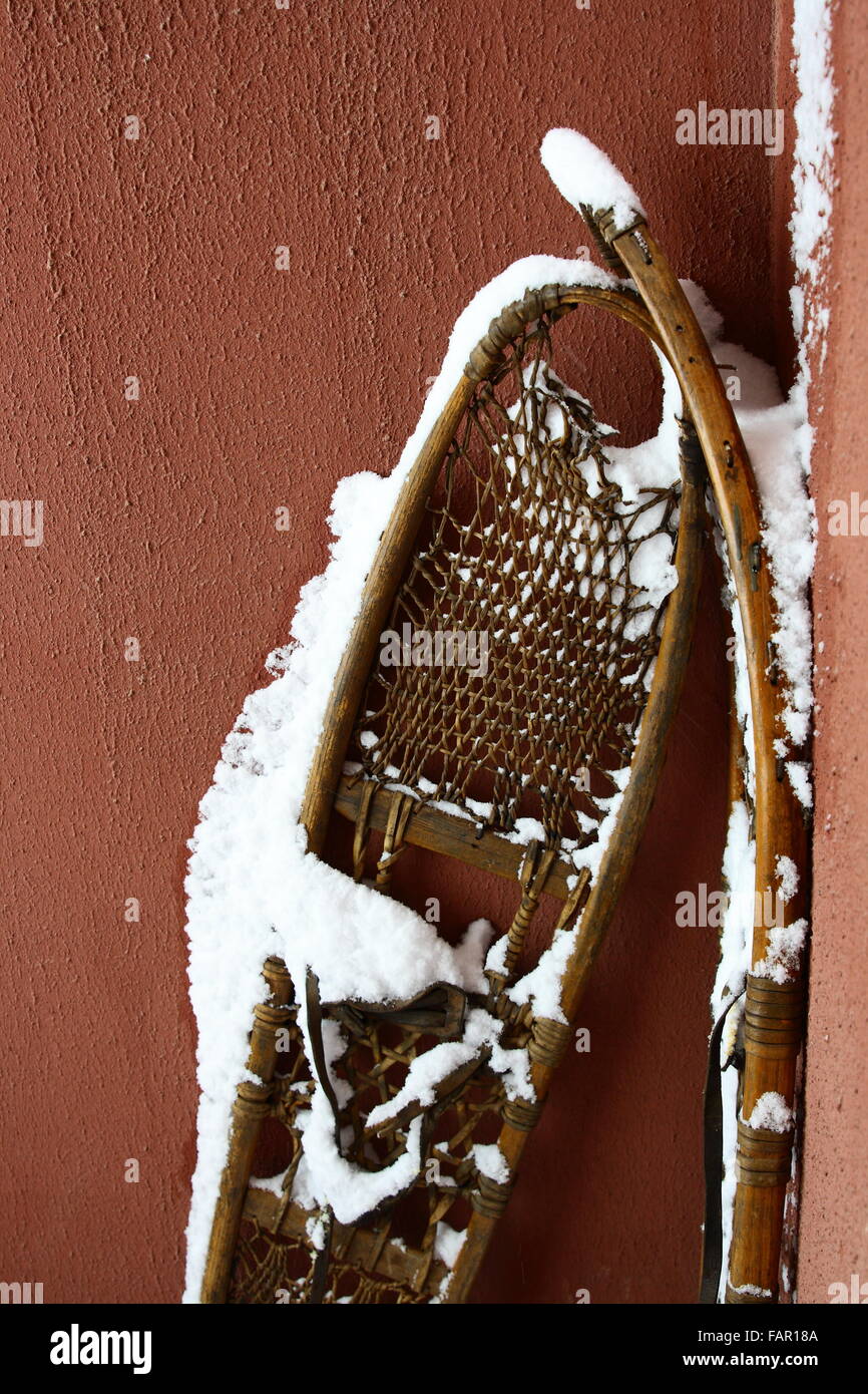 old snowshoe with snow on it Stock Photo