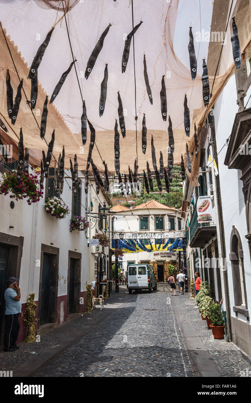 Madeira - Camara de Lobos fishing port, festival of St Peter. Town decorated with paper espada fish celebrating the annual seaso Stock Photo