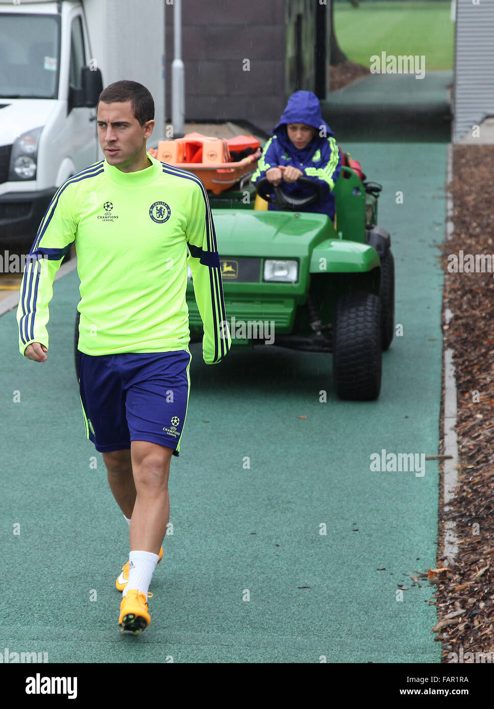 Cobham, Surrey, UK. 3rd January, 2016.  Eden Hazard Chelsea Footballer is pursued by Chelsea Team Doctor Eva Caneiro out onto the practice pitch before the  troubles at the Swansea game at the start of the 2015/16 premiere league season Credit:  Motofoto/Alamy Live News Stock Photo