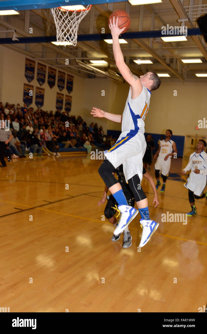 Player goes up for a layup in a high school basketball Stock Photo