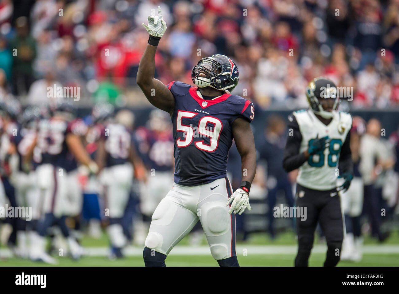 Houston, Texas, USA. 3rd Jan, 2016. Houston Texans outside linebacker Whitney Mercilus (59) celebrates after making a sack during the 2nd quarter of an NFL game between the Houston Texans and the Jacksonville Jaguars at NRG Stadium in Houston, TX on January 3rd, 2016. Credit:  Trask Smith/ZUMA Wire/Alamy Live News Stock Photo