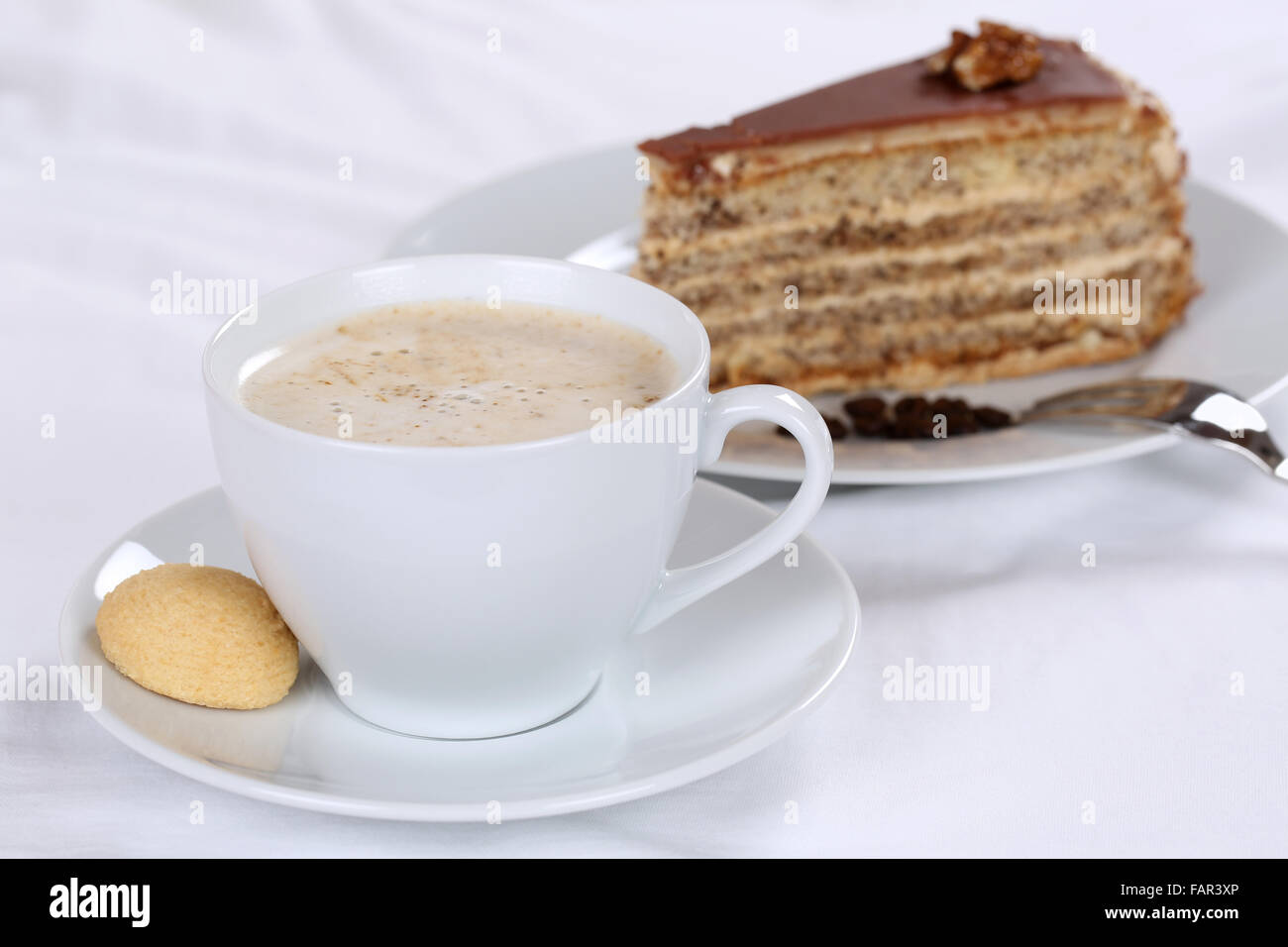 Hot fresh coffee and nut cake tart dessert sweet pastry Stock Photo