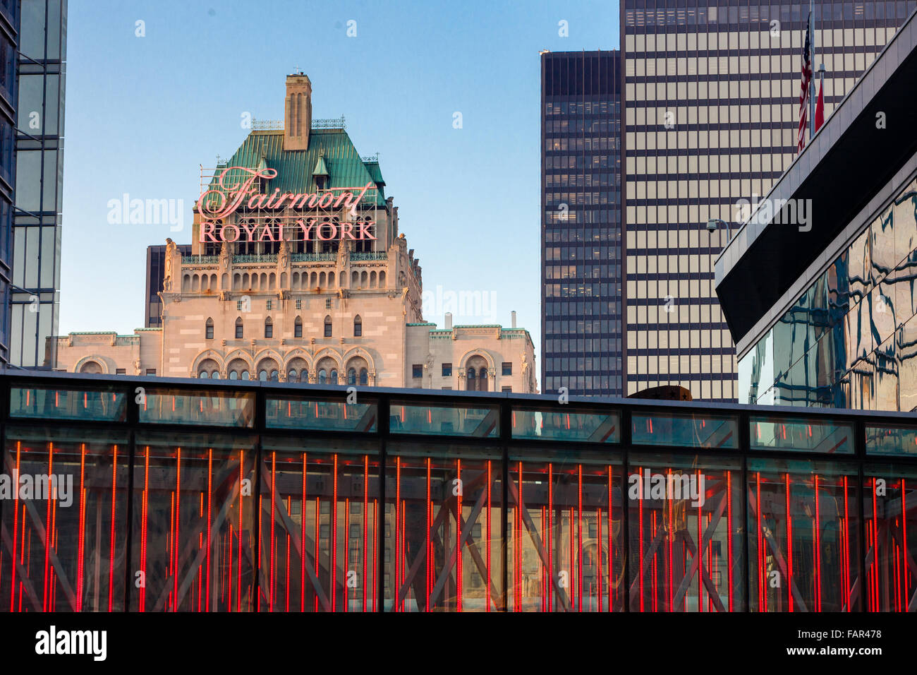 A view of The Royal York Hotel framed by other buildings and structures. Stock Photo