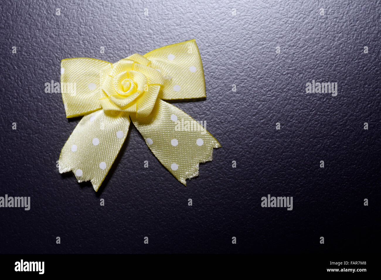 Yellow ribbon isolated on the black background Stock Photo - Alamy