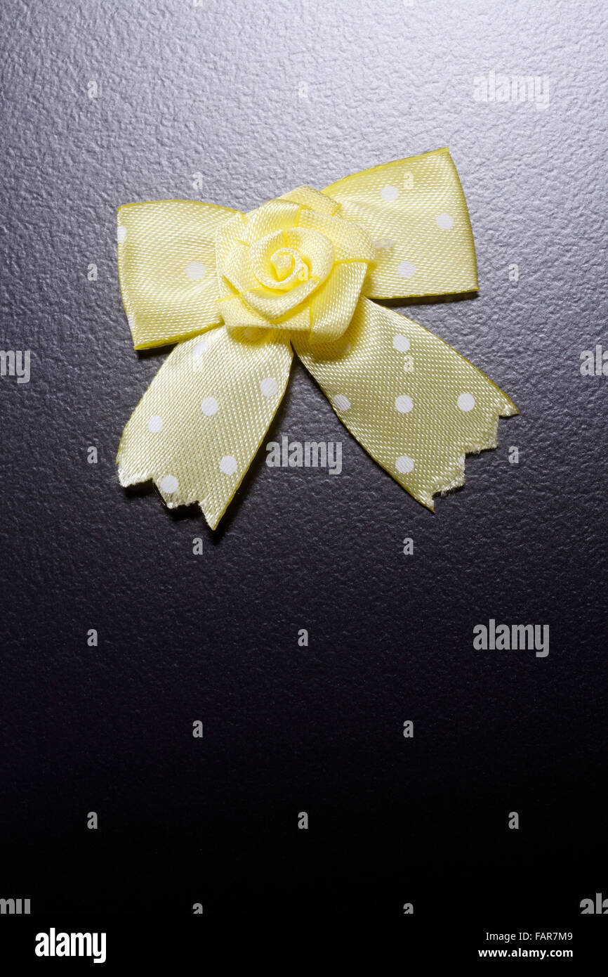 Yellow ribbon isolated on the black background Stock Photo - Alamy
