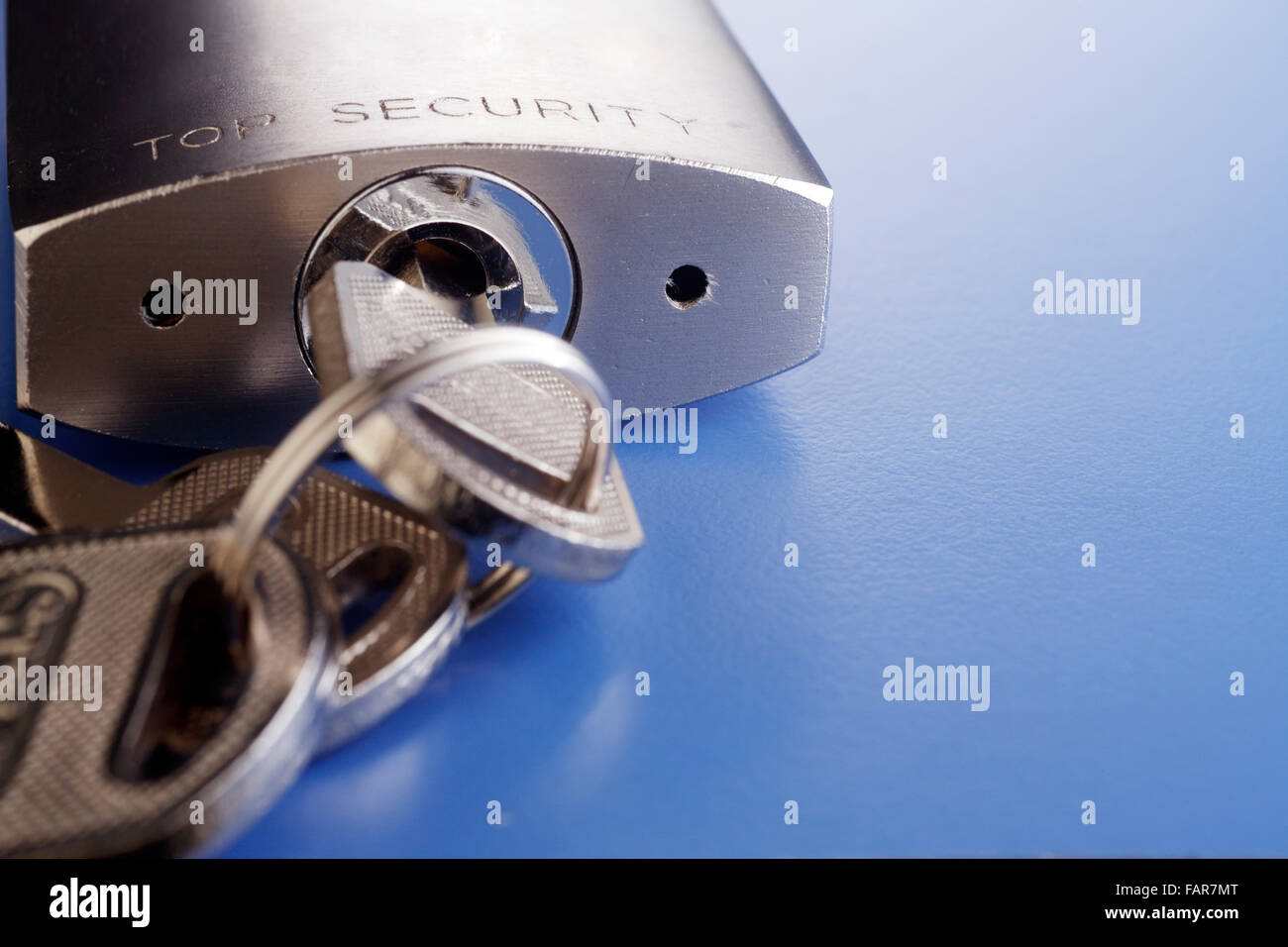 Padlock with key isolated on background Stock Photo - Alamy