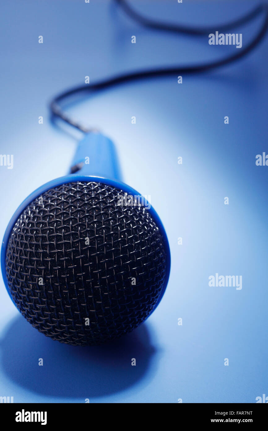 Blue microphone isolated on the blue background Stock Photo Alamy