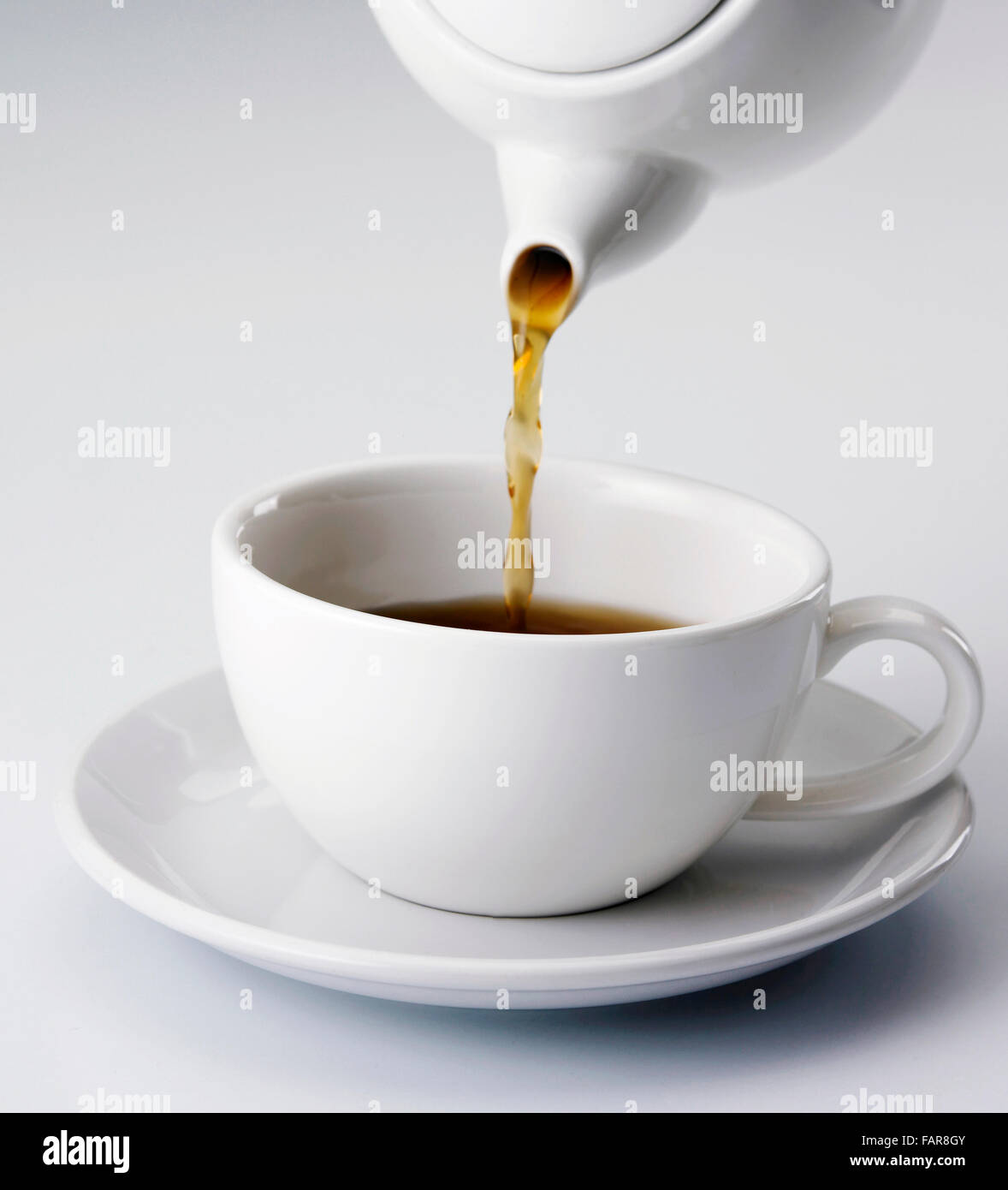 close up of filling up with tea on the plain background Stock Photo - Alamy